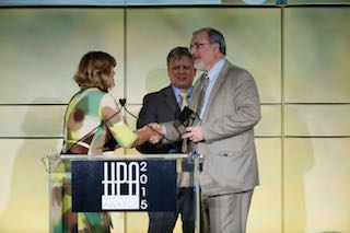 Panasonic's senior technologist Steve Mahrer (right) accepts the Engineering Excellence Award from HPA presenters Barbara Lange and Joachim Zell (left, center) during the tenth annual HPA Awards gala at the Skirball Center in Los Angeles