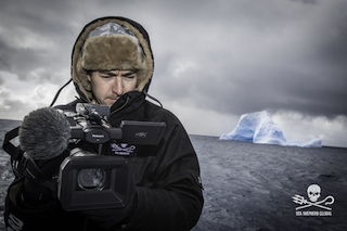 Producer and cinematographer Gavin Garrison films a field of icebergs using the DVX200 on the deck of the M/Y Ocean Warrior off the coast of Antarctica.  ©Simon Ager/Sea Shepherd Global.