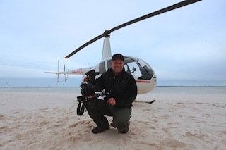 DP David E. West holding Canon EOS C300 on location for Blunt Force
