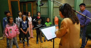Syrian children recording the Yusef Islam’s (formerly Cat Stevens’) ballad How Can I Tell You. 
