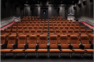 For English, any conversation about cinema design starts long before the house lights are dimmed, or the first movie ticket is sold. “The focus,” she says, “is on the patron and the seat.”