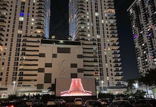 Nite Owl Theatre has created a laser projection drive-in cinema experience in the heart of Miami, Florida.