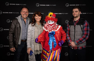 Brittany Herriman (in the clown suit) with her parents and husband at a screening of Animal World.