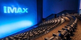 IMAX and Strong/MDI Screen Systems have partnered to build a record breaking-screen at the Traumpalast Multiplex in Leonberg, Germany. Covering a 574-seat IMAX auditorium, the Strong/MDI screen is an impressive 69 feet high and 125 feet wide and weighs more than 500 pounds, another IMAX record. It was manufactured in Joliette, Canada and coated on site by Strong/MDI professionals due to its massive measurements.