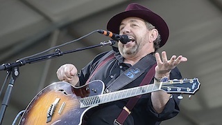 But what about James Dolan? It’s true that he is in charge of Madison Square Garden, the New York Knicks pro basketball team and the New York Rangers pro hockey team. He has used those entertainment connections to foster the success of the blues band he fronts called JD and the Straight Shot.