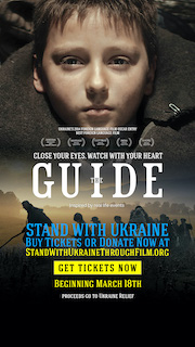 On Friday, March 18, many leading U.S. movie exhibitors will begin to play Oles Sanin’s acclaimed feature film The Guide, subtitled, in their theatres with box-office proceeds to be donated to Ukrainian Relief Efforts.  The film’s director and producer, Sanin, is currently locked down in Kyiv, but has just provided a moving introduction now attached to the movie. It conveys the urgency of the situation and the need for assistance. 