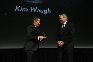 Kim Waugh, right, receiving the HPA Lifetime Achievement Award from Jeff Nagler.