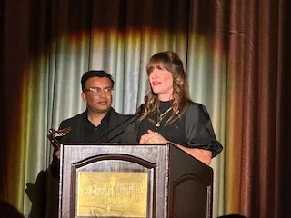 Sriram Iyer, left, and Meagan Keane of Adobe accepting the AIS 2023 Century Award.