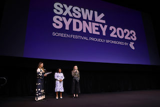 Kitty Green, director of The Royal Hotel (right) speaks alongside actor Ursula Yovich, and Ghita Loebenstein, head of screen for SXSW during the SXSW Sydney opening night screening of the film. (Photo by Brendon Thorne/Getty Images for SXSW Sydney)
