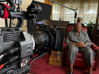 To capture the look that he was searching for to tell this story, Henry relied heavily on his personal set of nine Cooke miniS4/i S35 prime lenses because of “the way that it photographs Black people...with a buttery texture to capture the story and make everyone – including people in their 80s – look great. That’s The Cooke Look.”